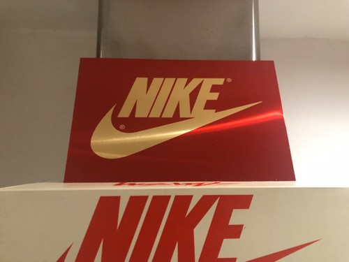 Insegna nike oro - nike, specchiato